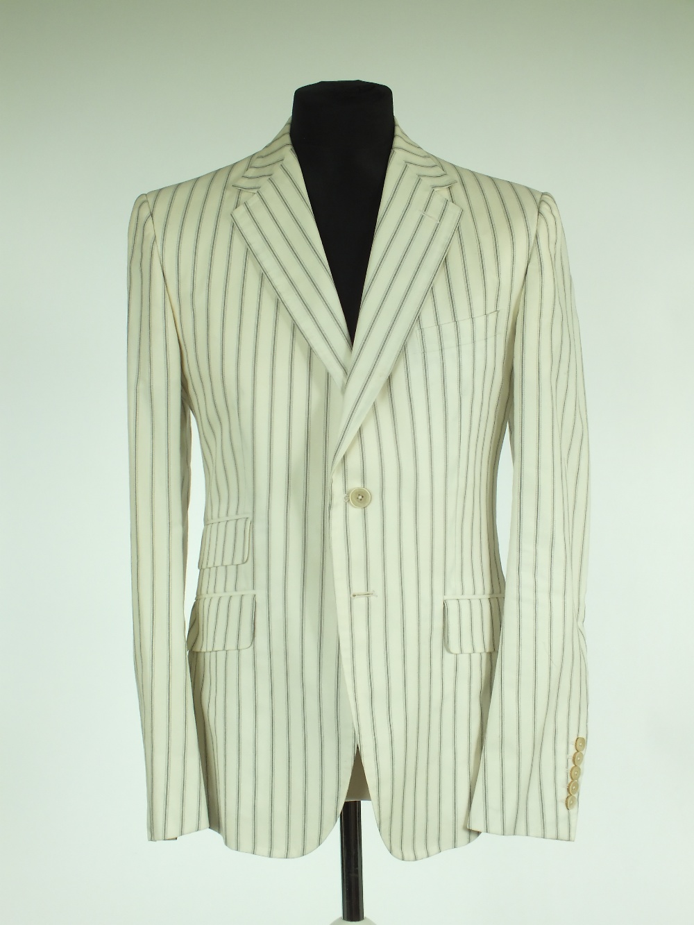 A Gucci suit, cream with blue pinstripe, jacket with single vent, lined, Italian size 52R, 100%