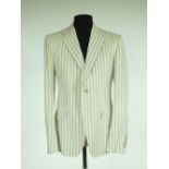 A Gucci suit, cream with blue pinstripe, jacket with single vent, lined, Italian size 52R, 100%