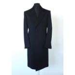 A Gucci coat, black velvet upper lapel, lined, single vent, Italian size 50R, 90% wool, 10%