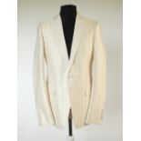 A Gucci dinner suit, cream, self strip with twill lower lapel, single vent, Gucci G embroidered to