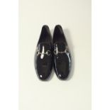 A pair of Gucci evening shoe, black patent with pewter horse bit detail, UK 8.5