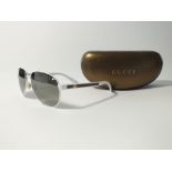 A pair of Gucci white Aviators