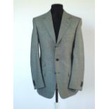 A Gucci suit, pale grey marl, double vent, 100% wool, Italian size 50R, flat front to trousers