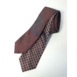 Two Gucci ties, one burgundy with small dot and G pattern, one burgundy with silver G pattern