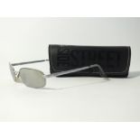 A pair of Ray Ban sunglasses in Side Street soft case