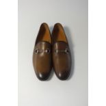 A pair of Gucci slippers, burnished tan leather with burnished silver horse bit, UK 8