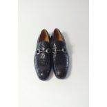 A pair of Gucci slip-on shoe, black crocodile leather with silver horse bit detail, with suede and