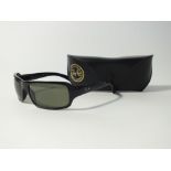 A pair of Ray Ban black wrap around sunglasses