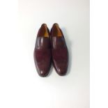 A pair of Gucci slip-on loafers, snake skin and suede, burgundy, Gucci stamp to upper detail, EU