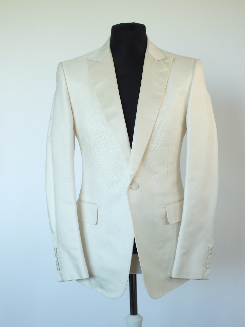 A Gucci cream dinner suit, single vent, woven satin lower lapel and pocket, satin detailing, Italian