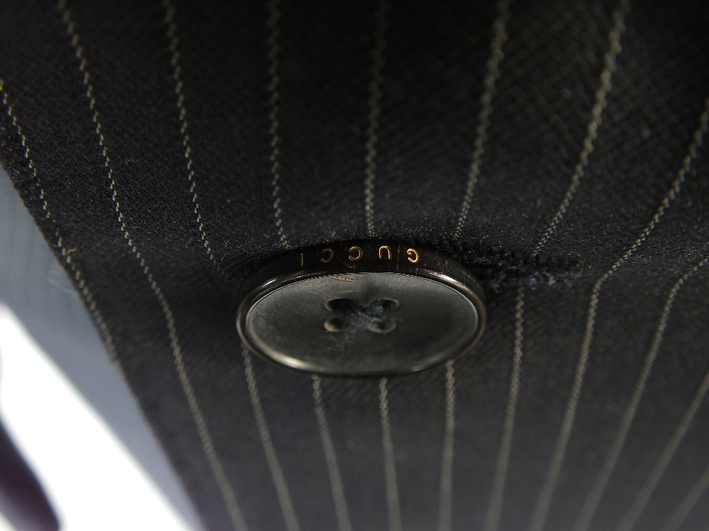 A Gucci suit, navy pinstripe, double vent, Italian size 50L, 80% wool, 20% silk, single pleat - Image 5 of 6