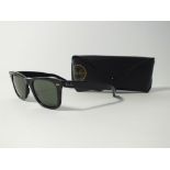 A pair of Ray Ban Wayfarer black sunglasses