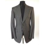 A Gucci suit, dark grey pinstripe, double vent, Italian size 50R, 100% wool, single pleat to