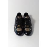 A pair of Dolce & Gabbana trainers, black and gold, snakeskin effect, UK 9, bagged