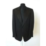 A Gucci dinner suit, black single breasted, satin lower lapel, satin detailing, double vent, satin