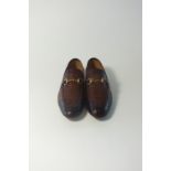 A pair of Gucci slip-on loafers, dark brown, alligator/crocodile, brass Gucci horse bit, UK 9,