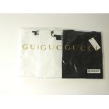 Three Gucci t-shirts, one black, two white, round neck, size L, packaged