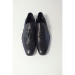 A pair of Gucci slip-on tasselled loafer black leather EU 42E, bagged not boxed