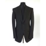 A Gucci suit, black, double vent, Italian size 50R, 75% wool, 25% mohair. Flat front, button fly