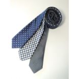 Three ties to include blue with white spot, blue with giant white spot and a skinny blue with tiny