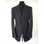 A Gucci suit, navy pinstripe, double vent, Italian size 50L, 80% wool, 20% silk, single pleat
