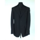 A Gucci dinner jacket, black, part velvet collar, double vented, lined, Italian size 50R, 100% wool