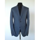 A Gucci suit, mid blue, lined in black, Italian size 52R, 65% cotton, 35% silk, flat front to