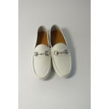 A pair of Gucci driving shoes, white, textured leather, silver horse bit, size UK 8.5