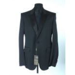 A Gucci dinner jacket, brand new with tag, black, satin lower lapel, satin details, lined, single