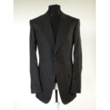 A Gucci suit, black pinstripe, Italian size 50L, 73% wool, 27% silk, double vent, flat front to