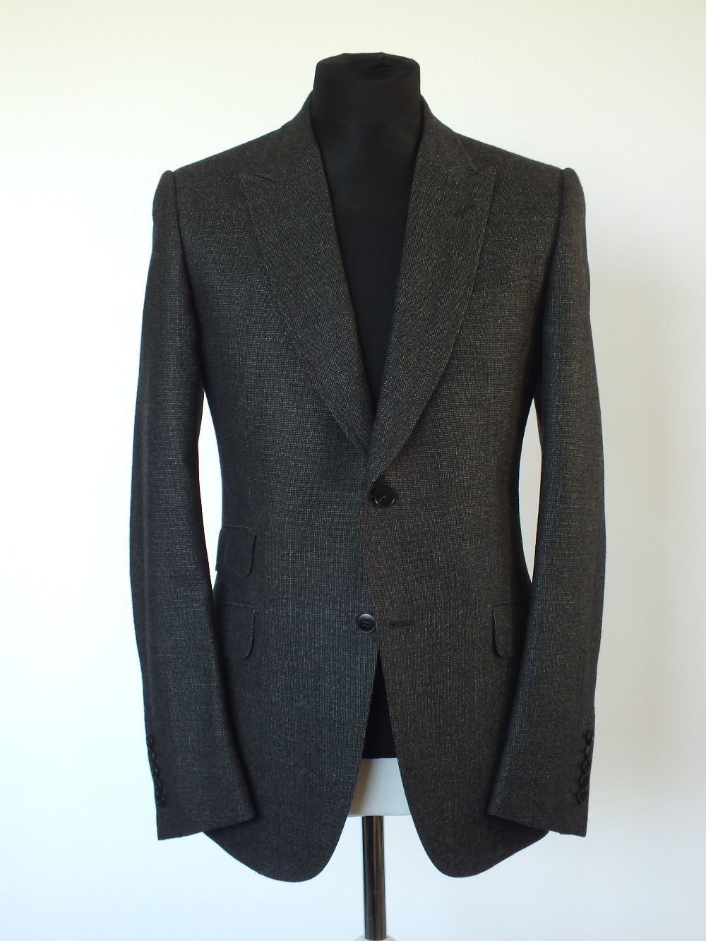 A Gucci suit, dark grey, double vent, Italian size 52R, 100% wool, flat front to trousers,