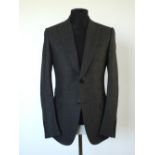 A Gucci suit, dark grey, double vent, Italian size 52R, 100% wool, flat front to trousers,