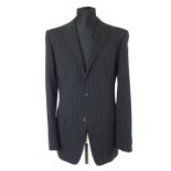 A Gucci suit, black narrow pinstripe, contrast lined in lilac, double vent, Italian size 50L, 97%