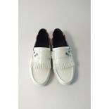 A pair of Gucci tasseled driving shoes with crest silver star burnished detailing to upper, white,