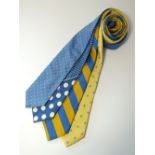 Four ties to include yellow and blue spotted, blue and yellow stripe with a yellow blue fleur de