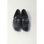 A pair of Gucci slippers, black patent leather with silver horse bit detail, UK 8, considerable