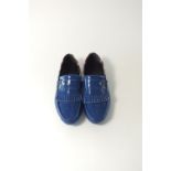 A pair of Gucci tasseled driving shoes, blue patent with crest silver star burnished detailing to