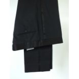 A pair of Gucci black evening trousers with self patterned geometric pattern to fabric, satin stripe