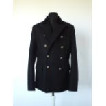 A Gucci coat, black velvet upper lapel, lined, single vent, inverted pleat detail to the back,