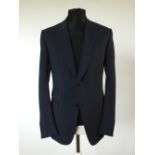 A Gucci suit, navy blue and black check, horse bit woven logo to lining, double vent, Italian size