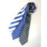 Three ties to include bright blue and cream stripe, grey blue stripe and a blue with white dots,