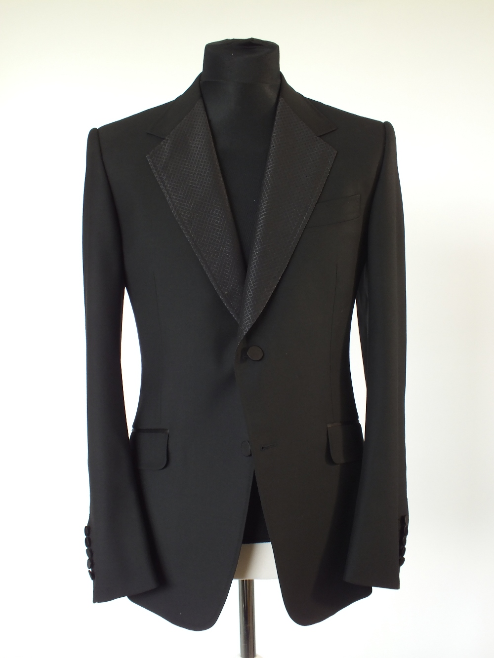 A Gucci dinner suit, black, lower lapel with satin detailing, double vent, Italian size 52R, 100%