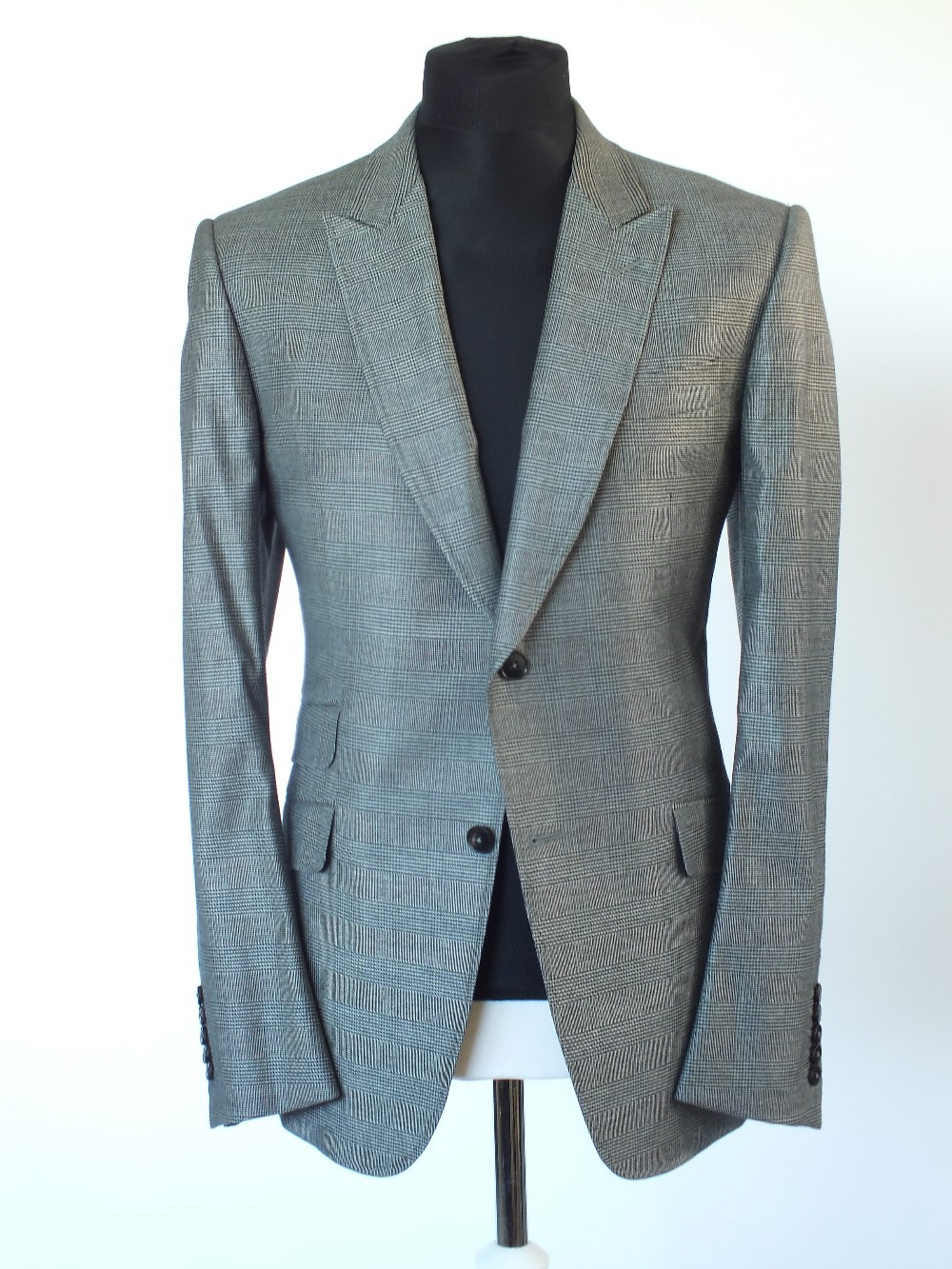 A Gucci three piece suit, Prince of Wales check, double vented, Italian size 52R, 55% wool, 42%