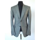 A Gucci three piece suit, Prince of Wales check, double vented, Italian size 52R, 55% wool, 42%
