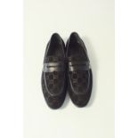 A pair of Gucci slip-on loafers, black suede with embossed Gucci logo detailing, Gucci logo to upper