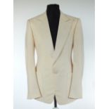 A Gucci dinner jacket, cream, grosgrain lower lapel, patch pockets, lined, double vent, Italian size