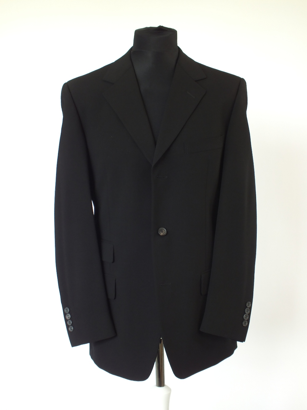 A Gucci suit , black, lined, double vented, Italian size 50R, 96% wool, 4% elastine. Flat front to