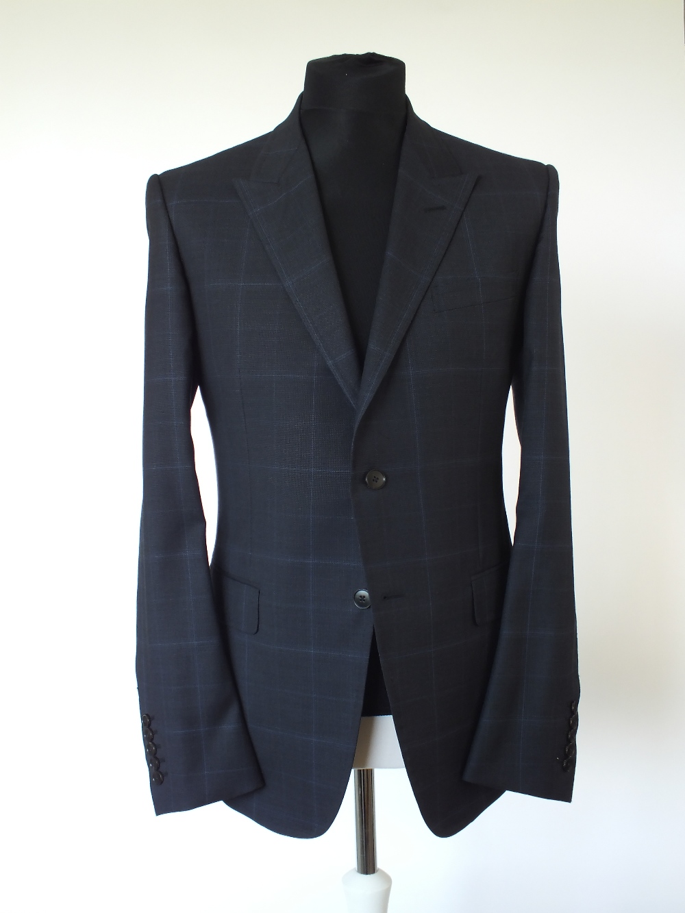 A Gucci suit, navy with blue check, single vent, woven horse bit pattern to lining, 52 regular, 100%