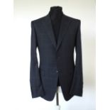 A Gucci suit, navy with blue check, single vent, woven horse bit pattern to lining, 52 regular, 100%