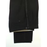 A pair of black evening trousers, staining to inside, satin strip to side